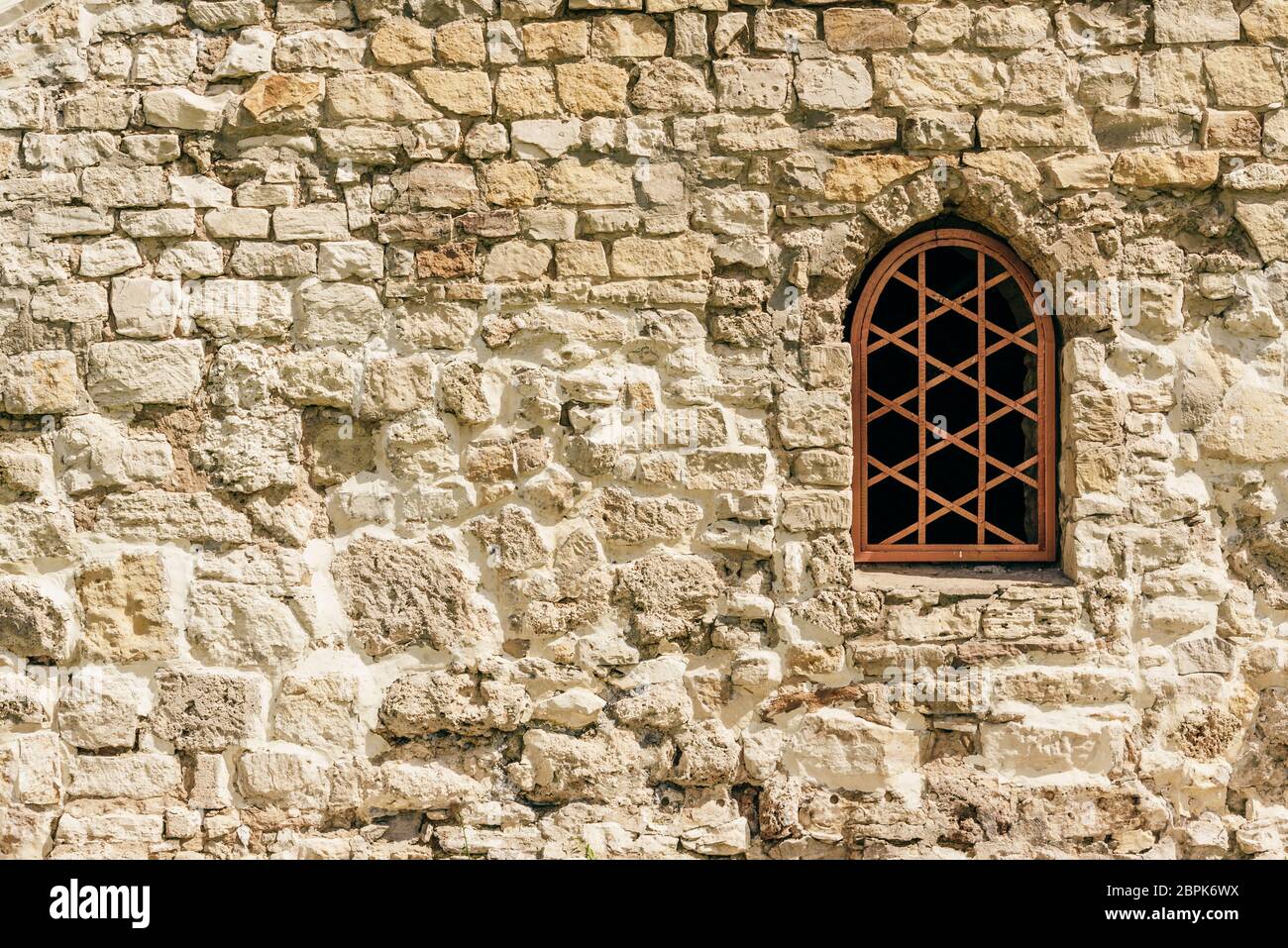 Old and weathered stone wall with window Stock Photo - Alamy