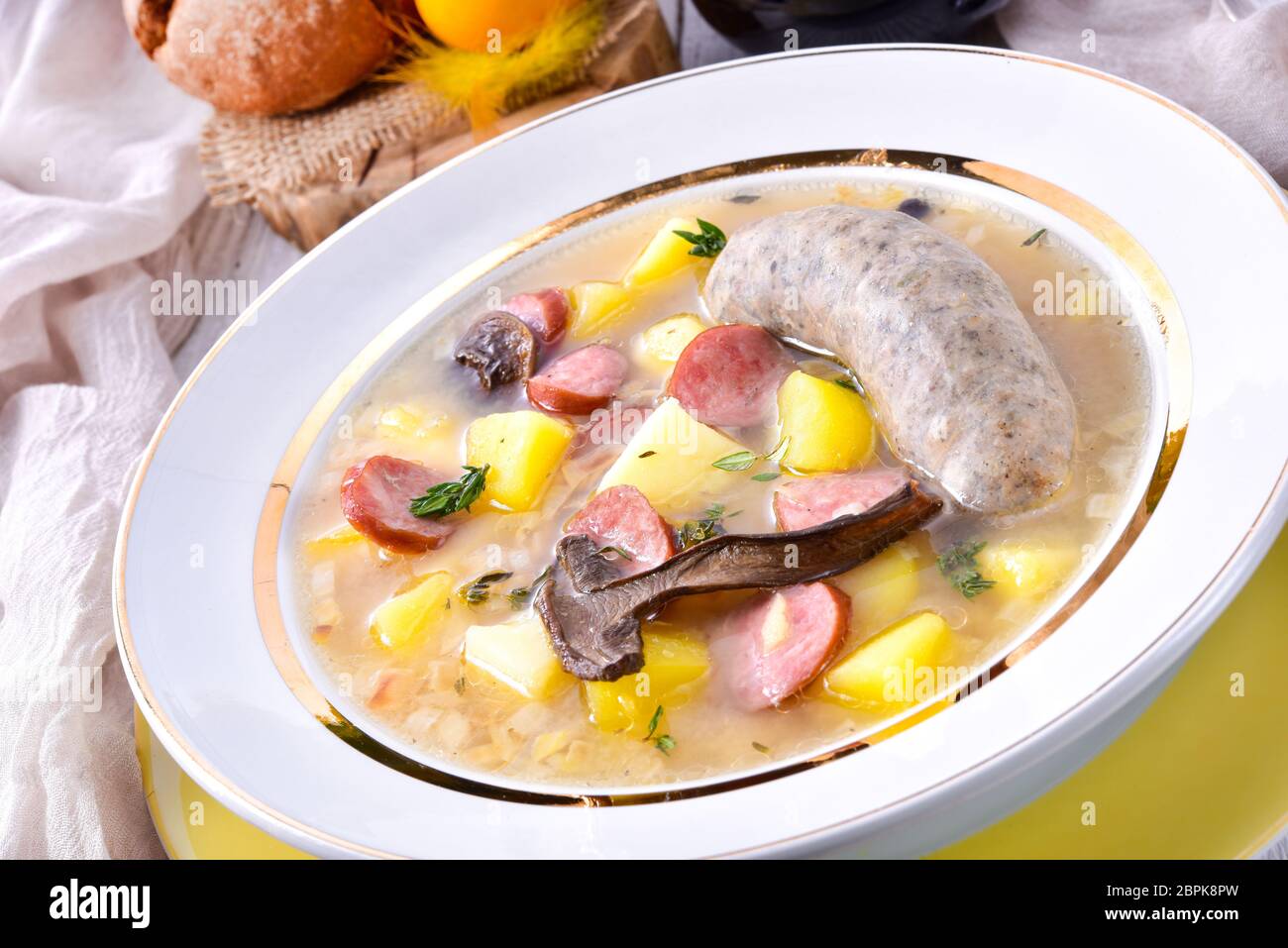 a polish easter soup with homemade white sausage and mushrooms Stock Photo