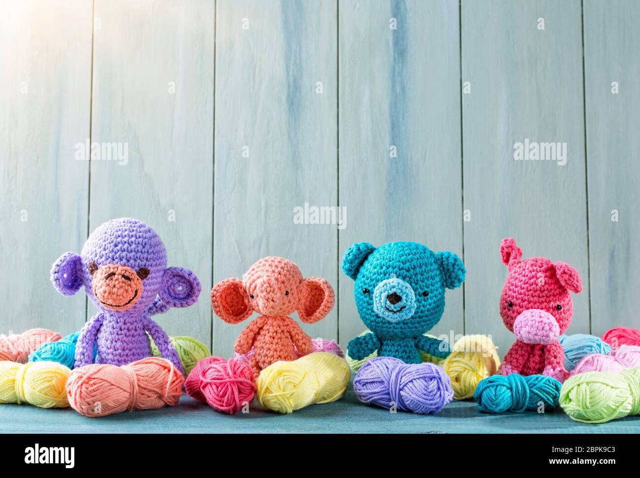 Amigurumi toys on a wooden background Stock Photo