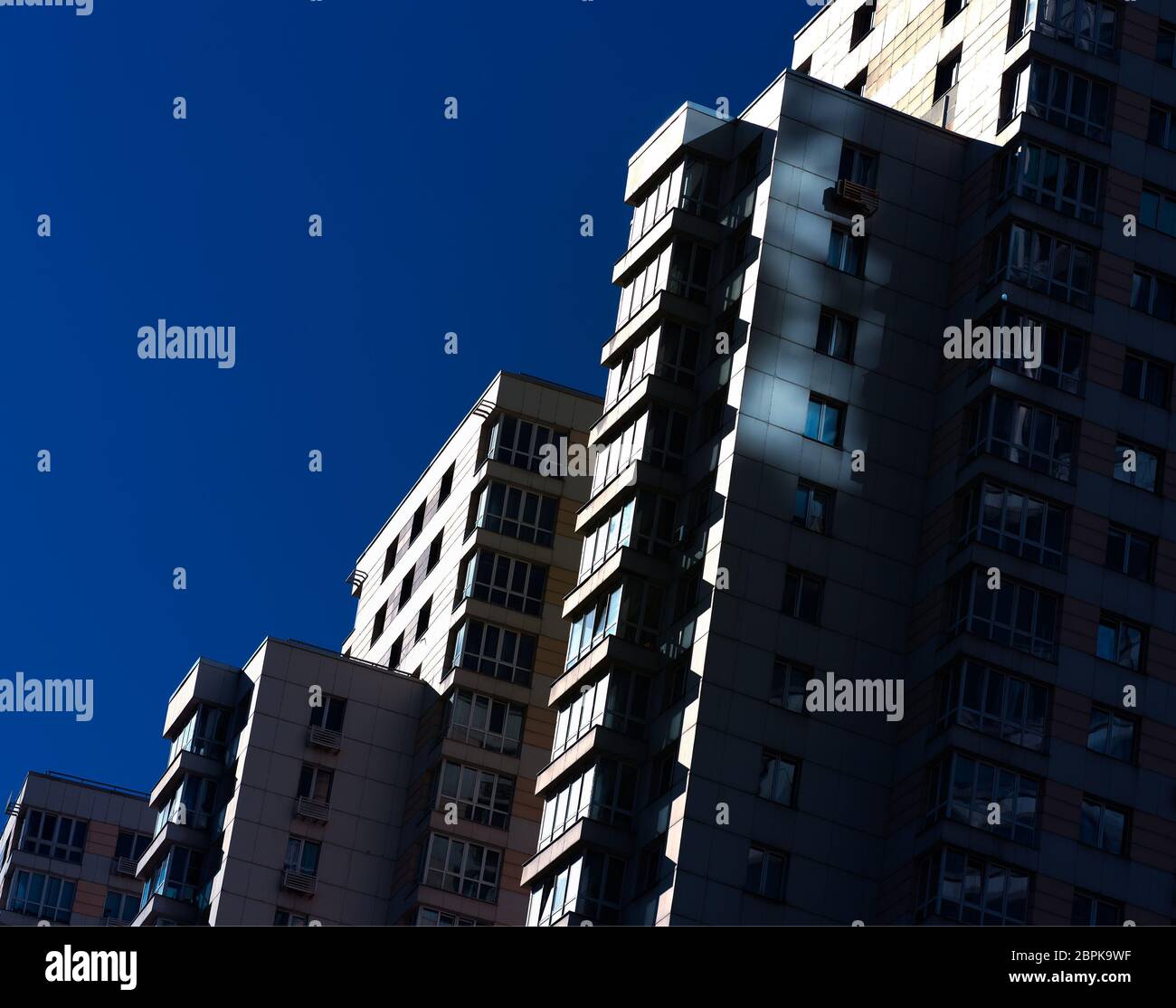 Dramatic tilted high rise architecture background Stock Photo - Alamy