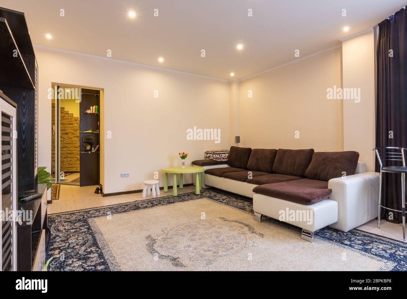 Living room interior with large sofa Stock Photo - Alamy