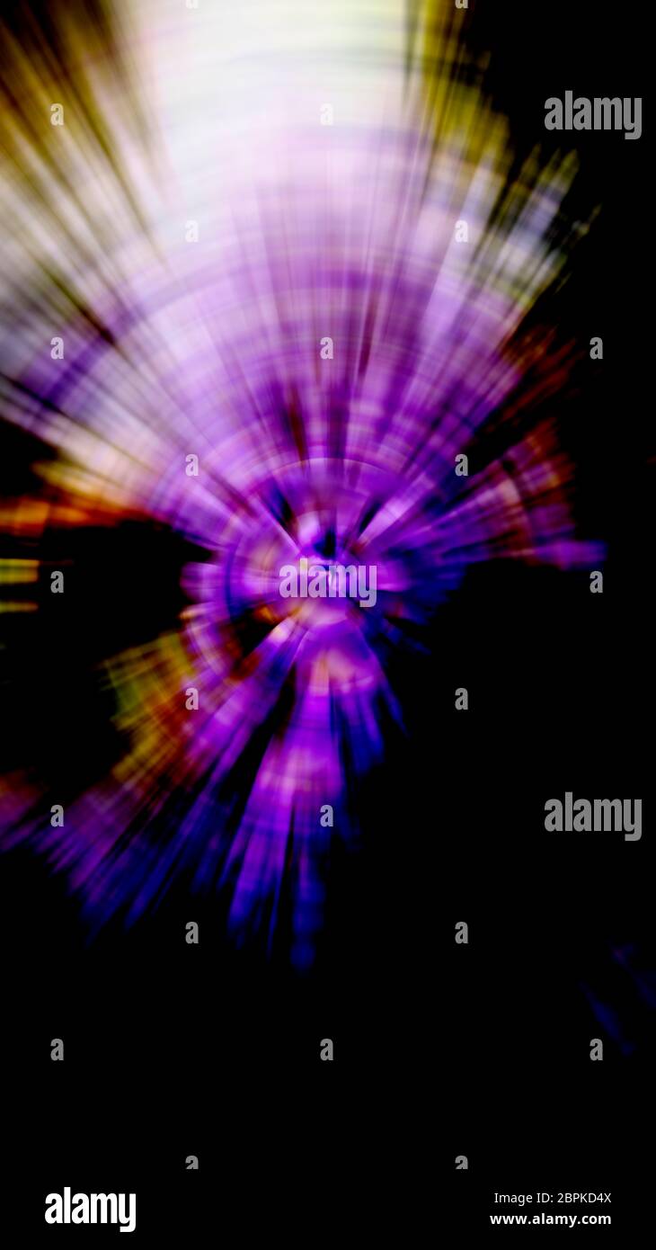Background image with central zoom blur and radial blur, purple and yellow-brown shades on black.Mysterious setting effect. Stock Photo