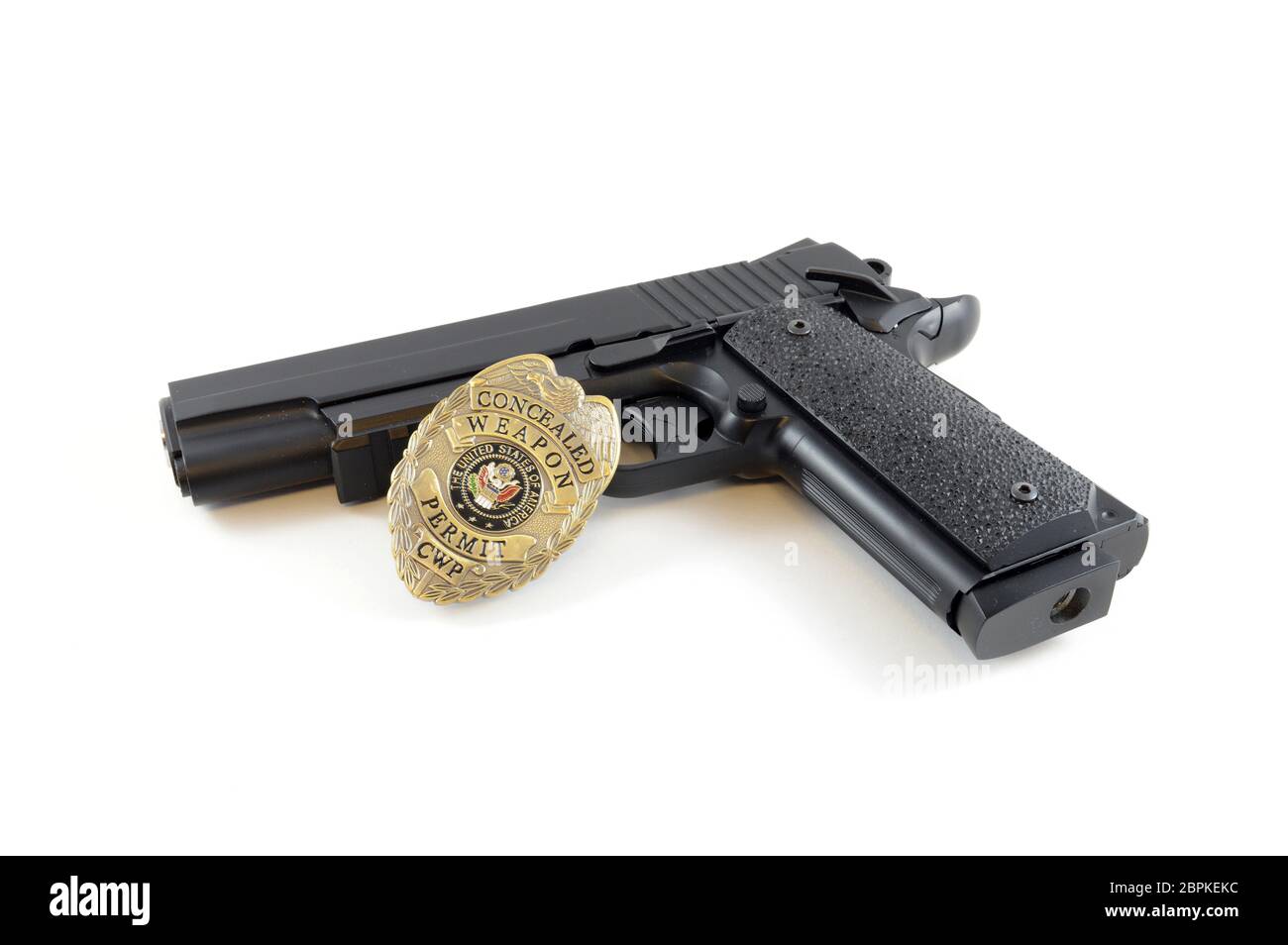 Isolated over white image of a police badge and handgun for law