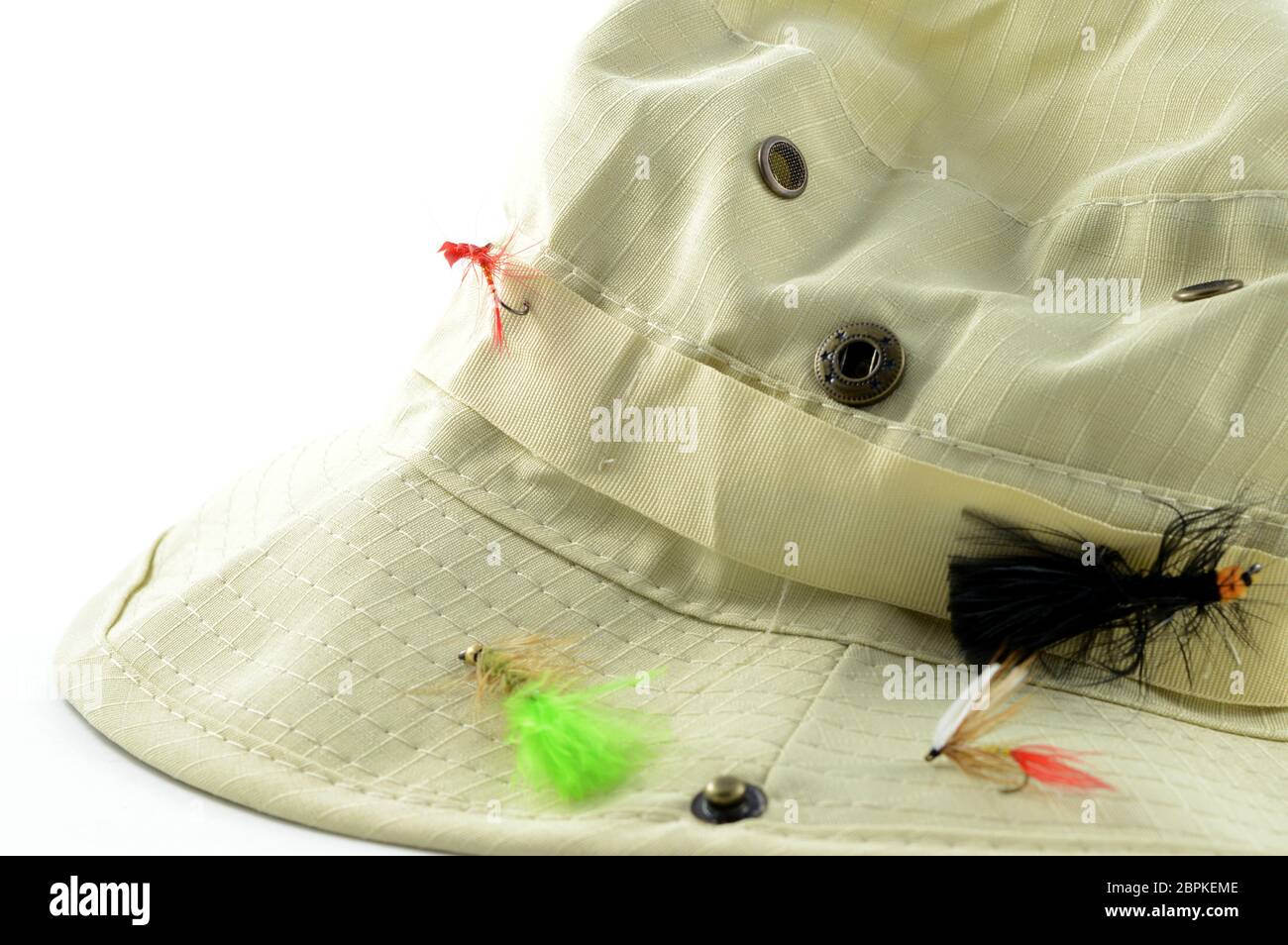 Closeup view of a fishermans hat with some fly bait hooks for easy