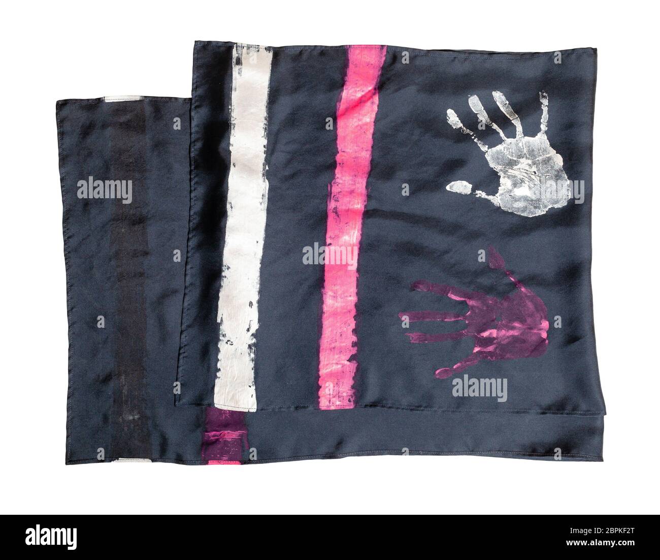 folded handcrafted black silk scarf with handpainted handprints isolated on white background Stock Photo