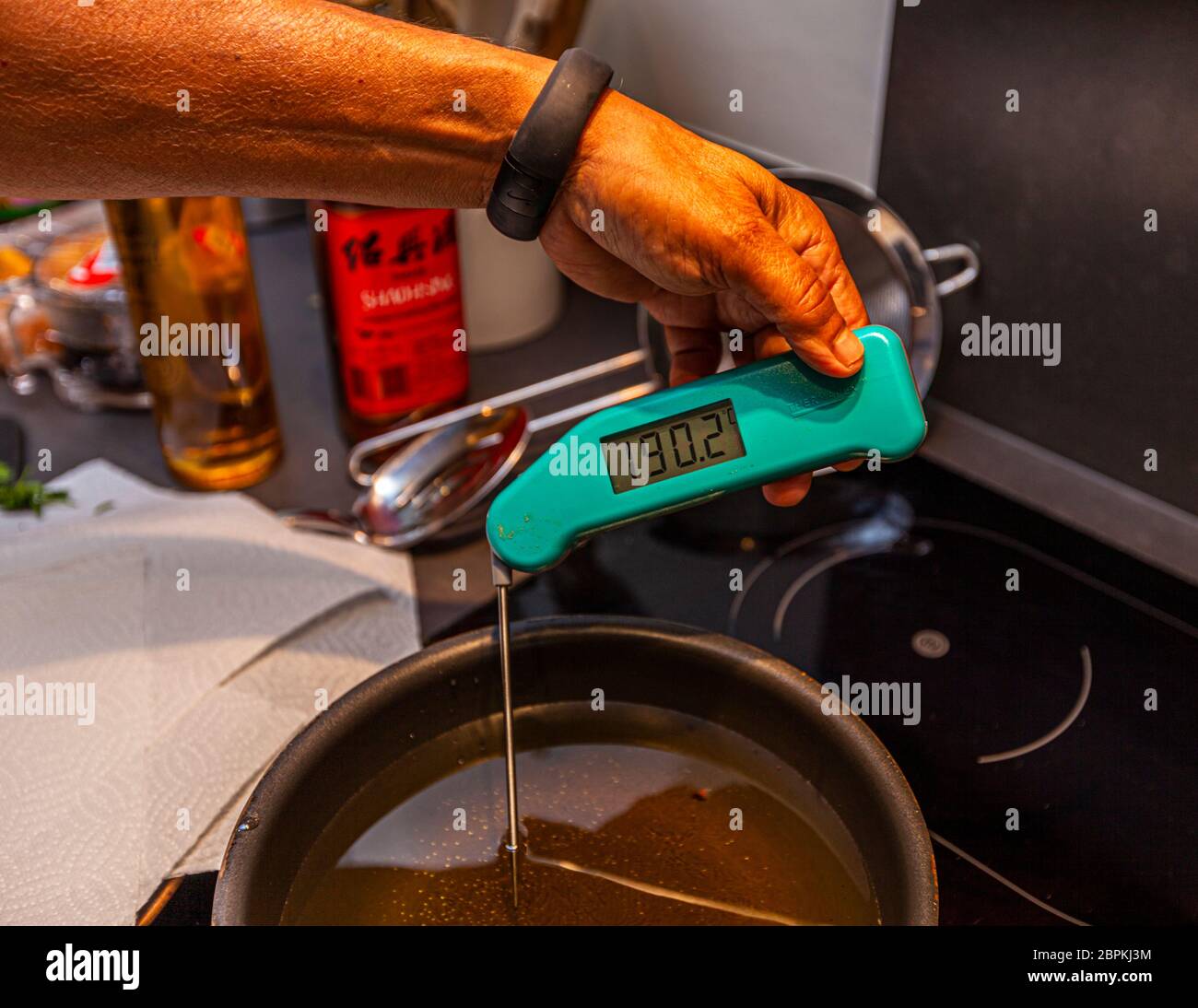 Spring rolls are deep fried in an oil bath, the temperature of which is