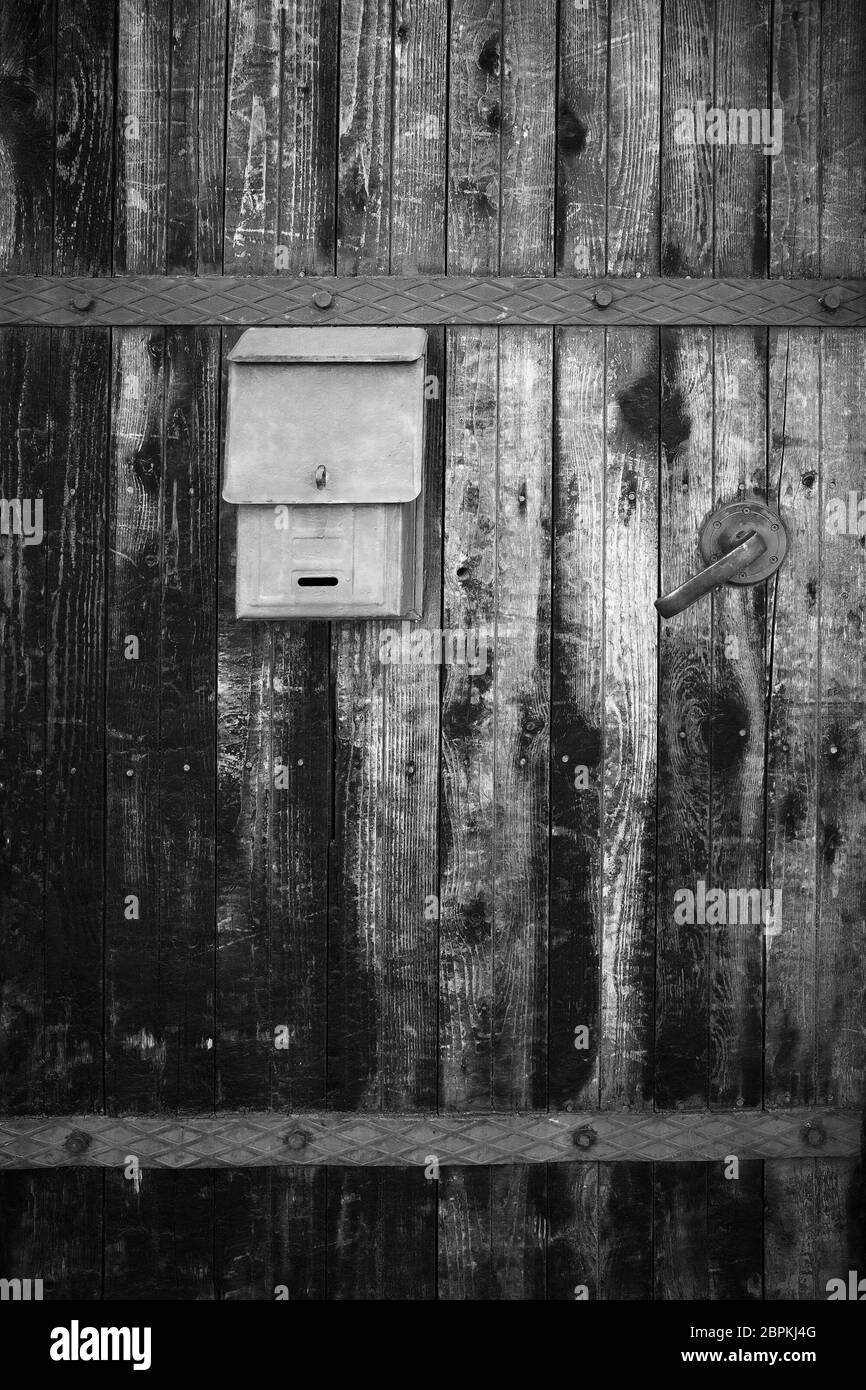 Old mailbox on fence Black and White Stock Photos & Images - Alamy