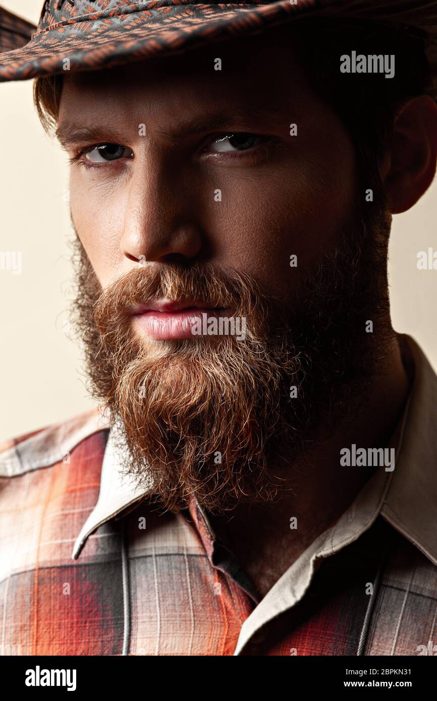Young handsome man in a cowboy hat Stock Photo