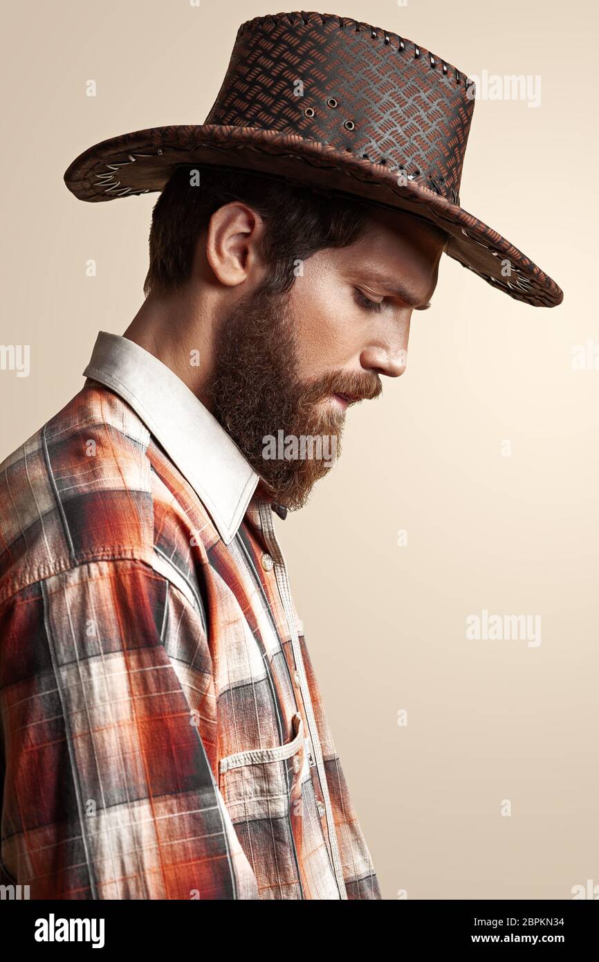Young handsome man in a cowboy hat Stock Photo
