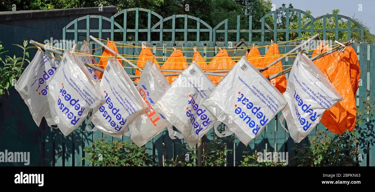 Reusable recycled plastic carrier shopping bags supplied by supermarket for home delivery of online grocery orders washed for reuse coronavirus safe Stock Photo