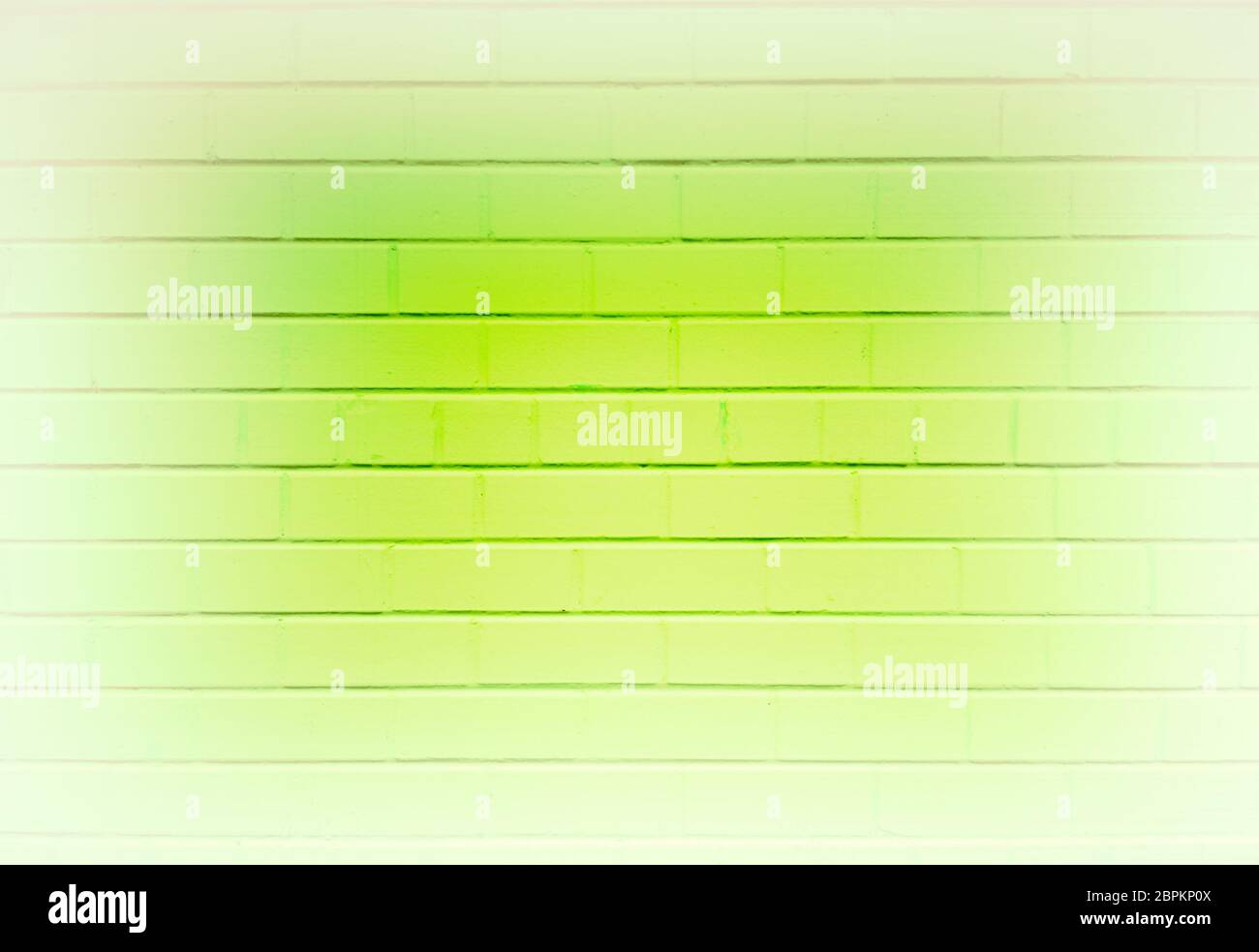 Abstract green brick wall vignette background Stock Photo - Alamy