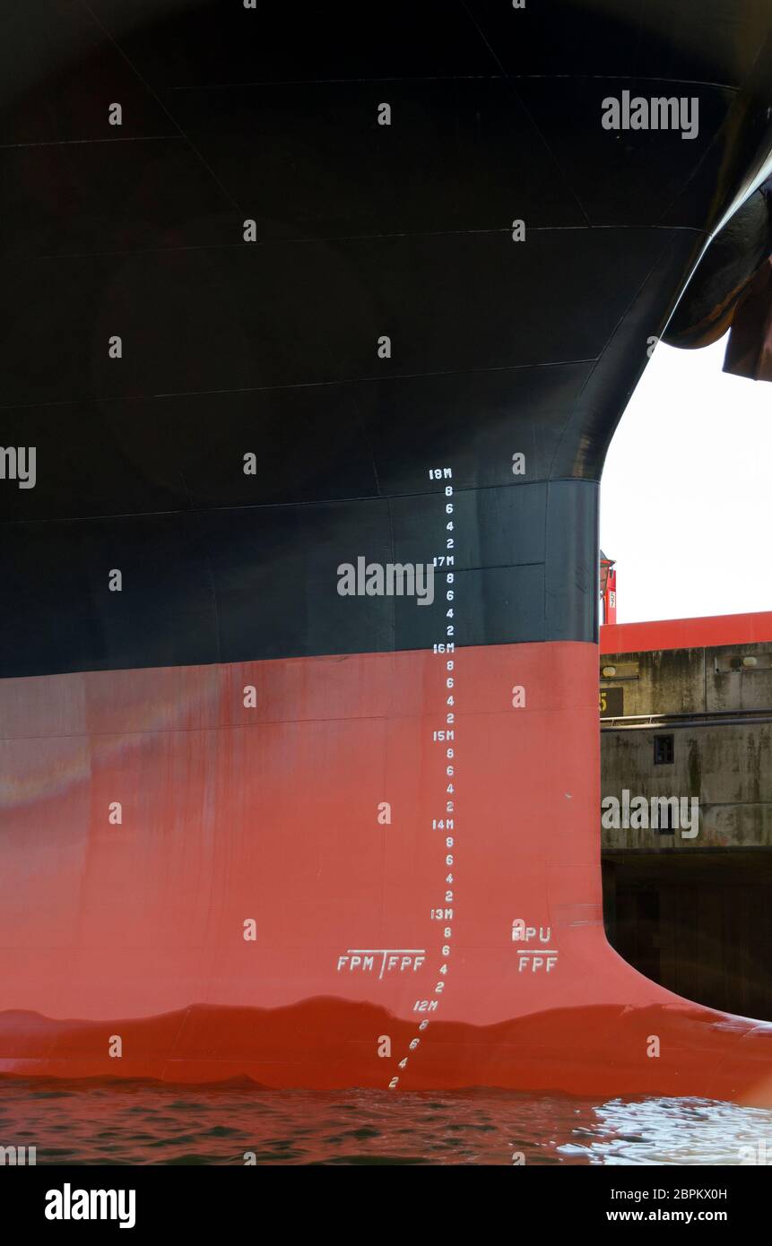 draft marks and water line on the bulbous bow of a container ship at