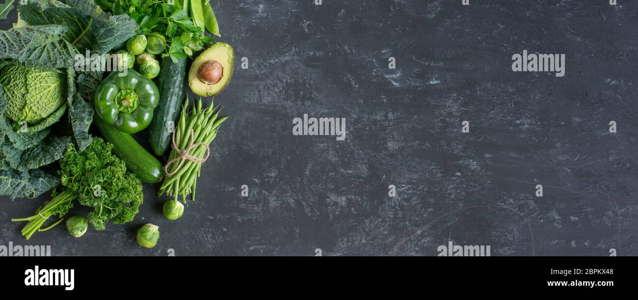 Slate background with green vegetables selection for a healthy ...