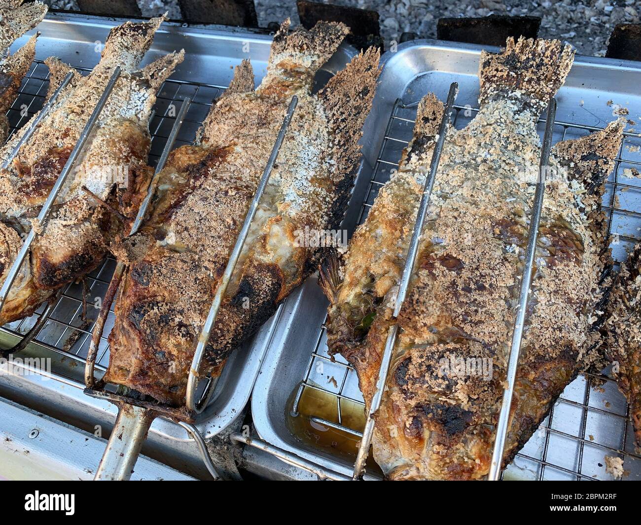 Barbecue Fish With Salt Crust, thai food on grill Stock Photo - Alamy