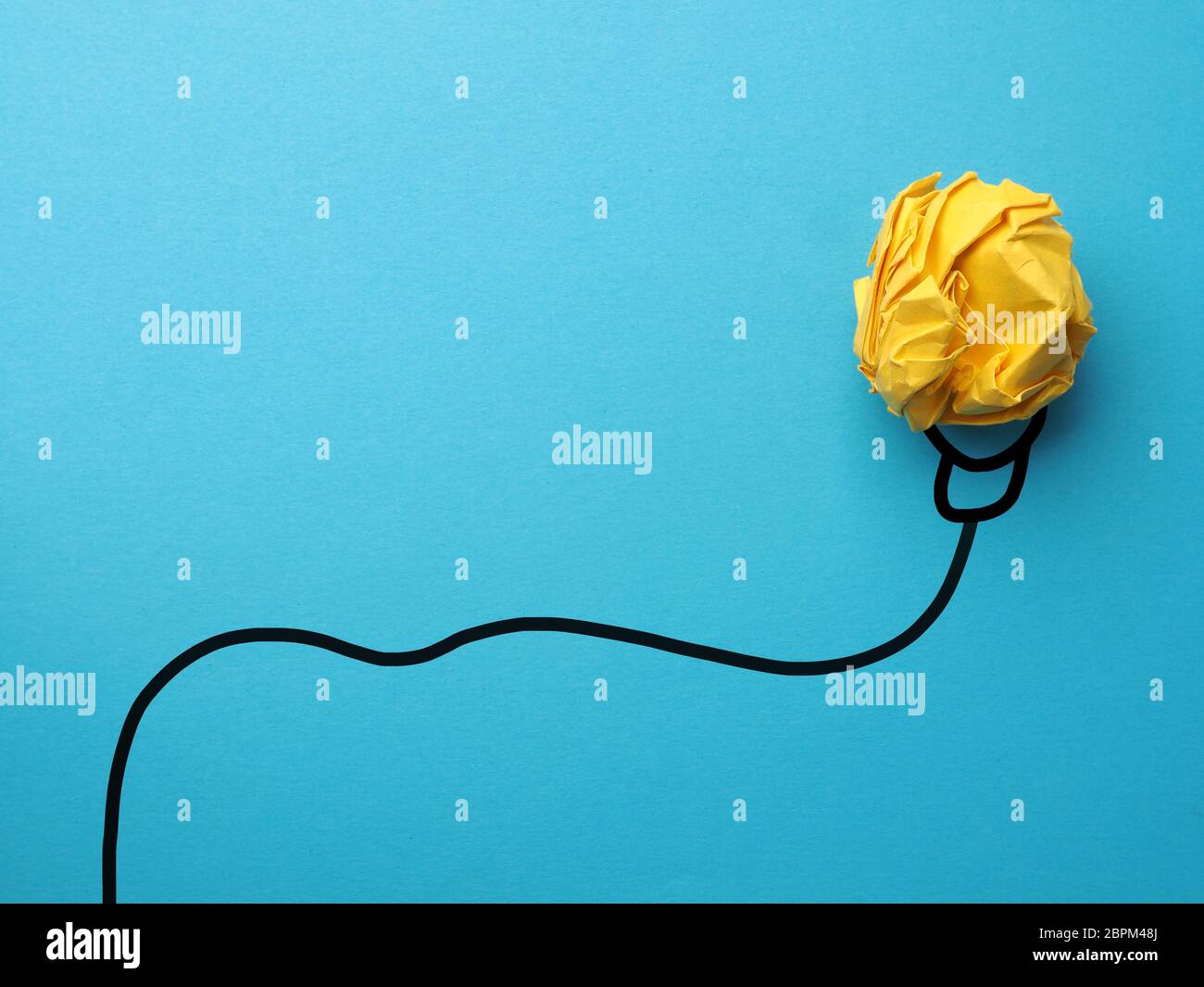 Creativity concept with crumpled yellow paper Stock Photo Alamy