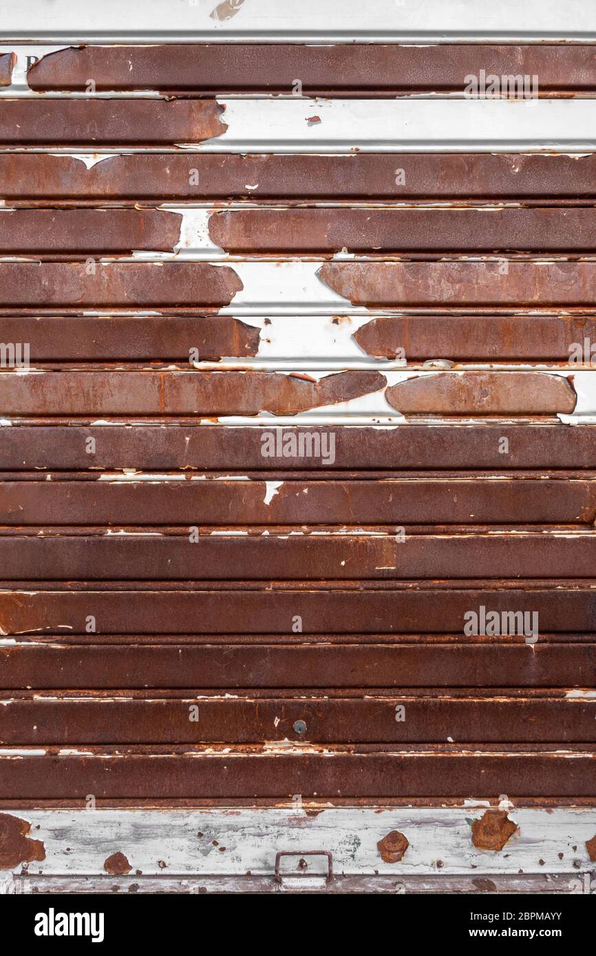 Old rusty garage shutter. Ideal for concepts and backgrounds. Stock Photo