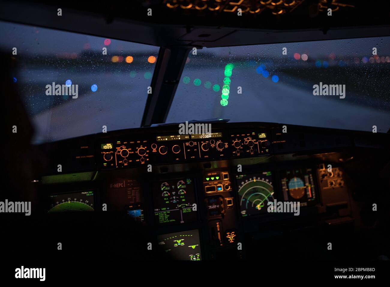 Pilot's hand accelerating on the throttle in a commercial airliner ...
