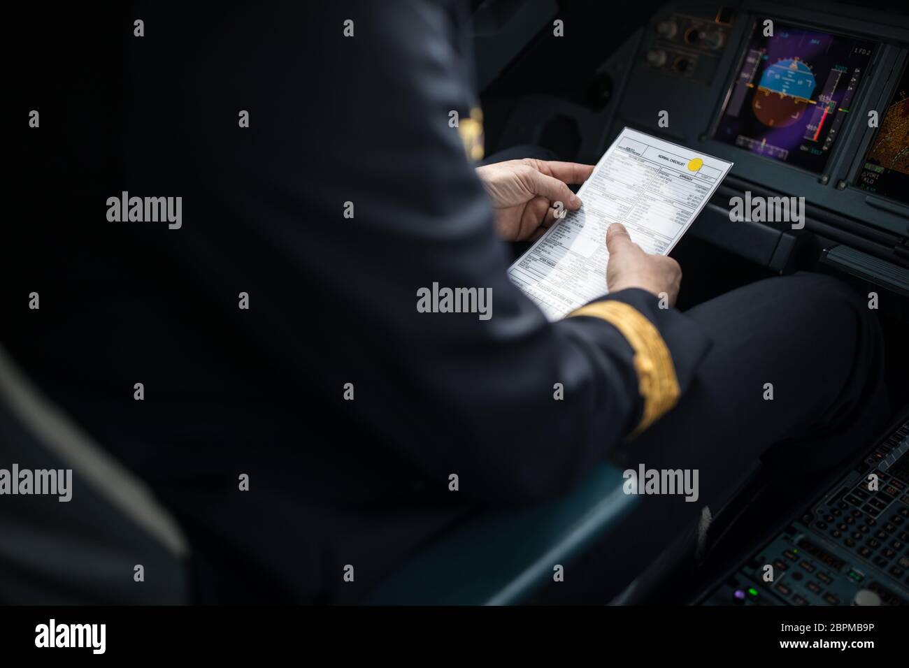 Pilot's hand accelerating on the throttle in  a commercial airliner airplane flight cockpit during takeoff Stock Photo