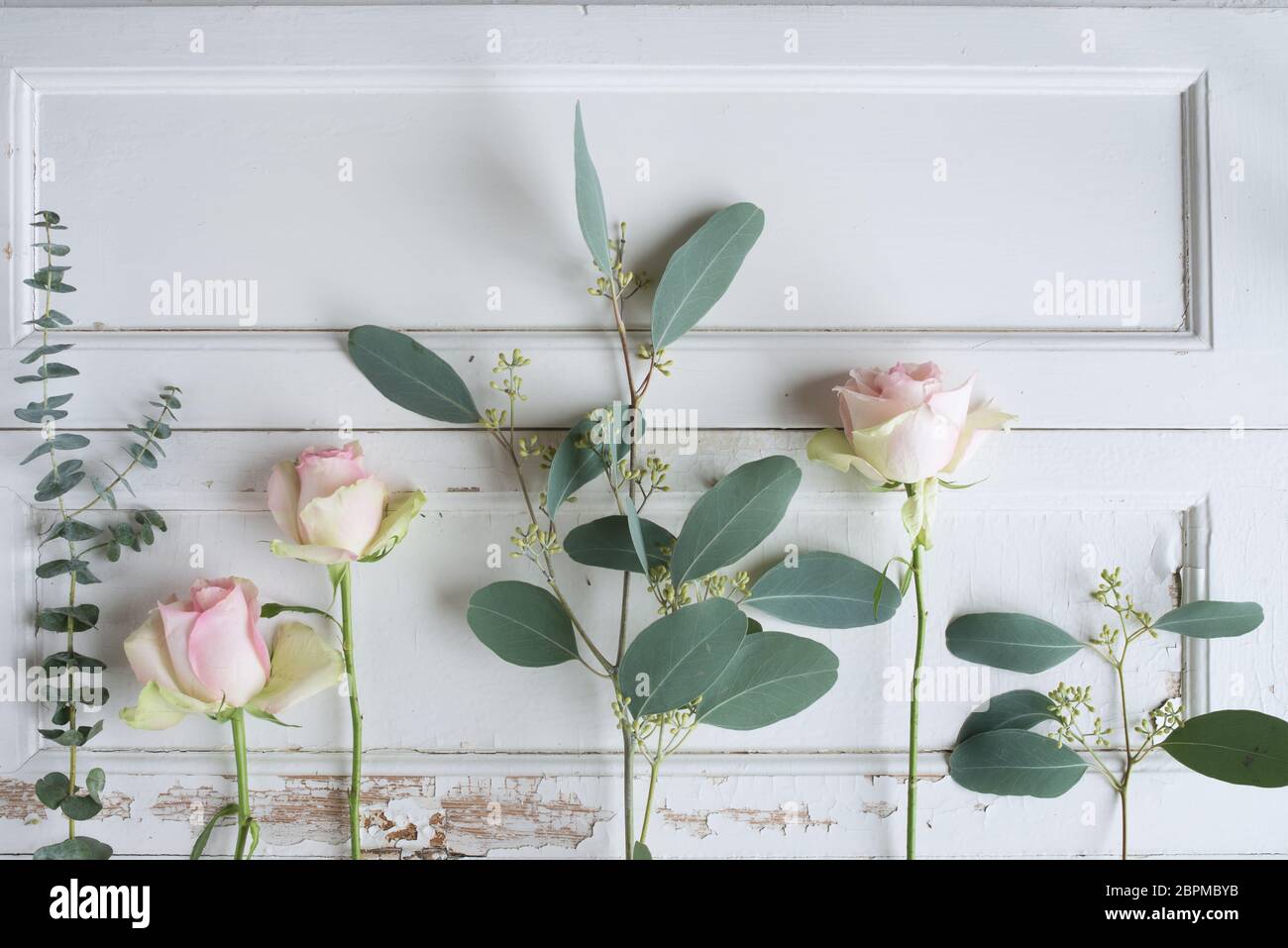 Flower decoration on white vintage wood for a mothers day background ...