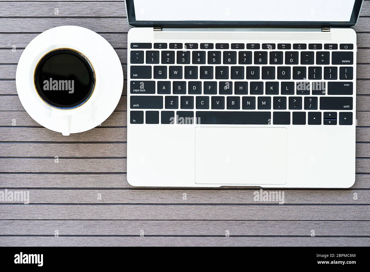 Top view coffee time , Office desk table with laptop,notebook, coffee ...