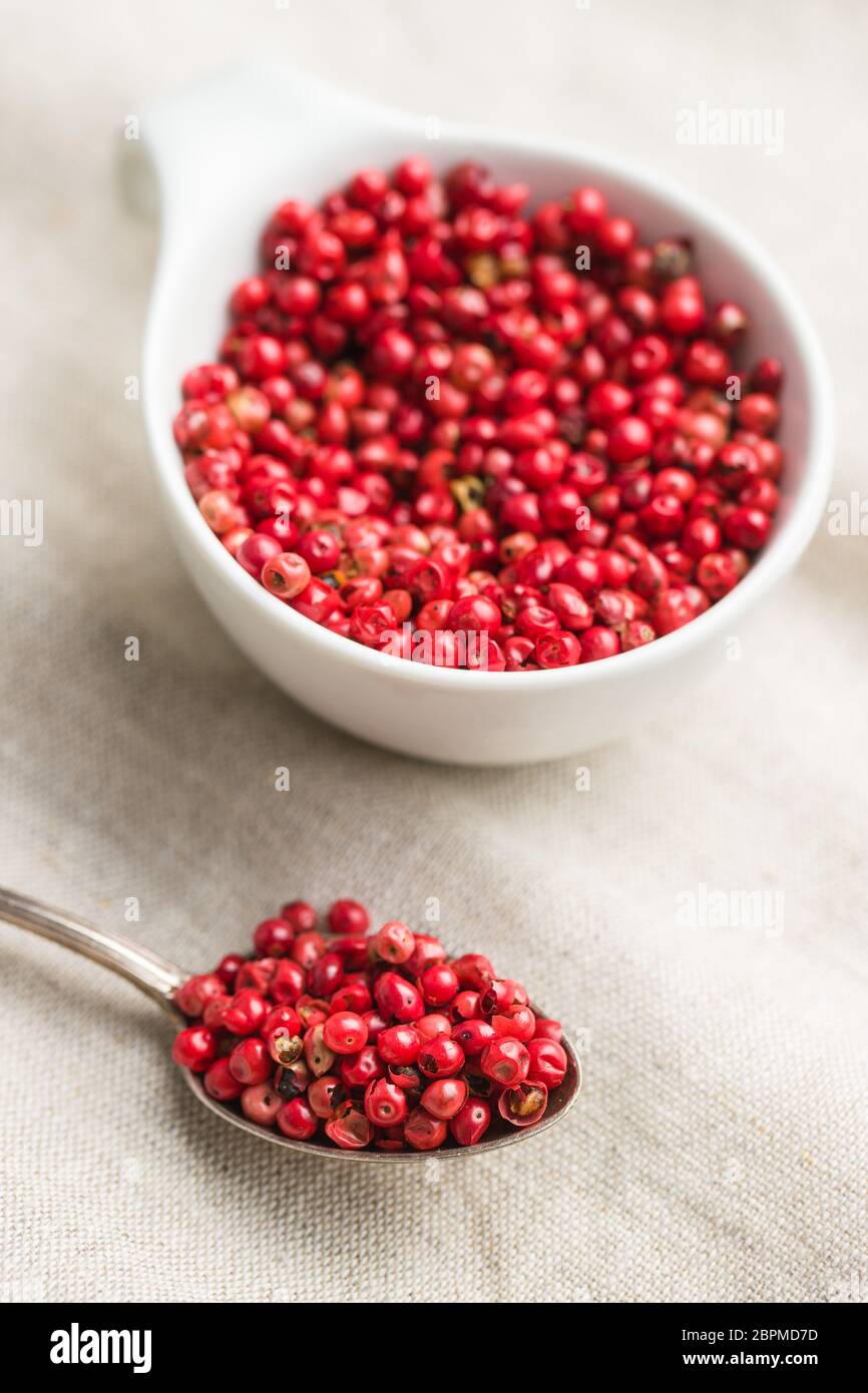 Dried pink peppercorn in spoon. Stock Photo