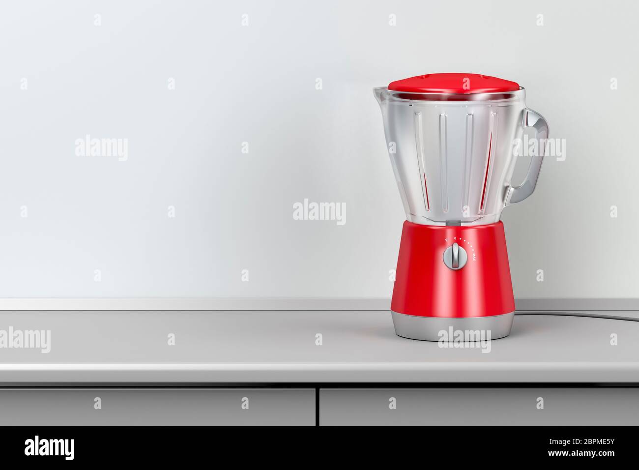 Red electric blender in the kitchen Stock Photo