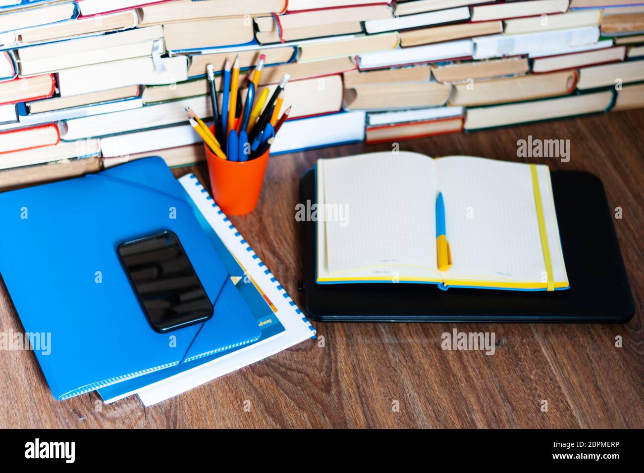 Textbook, notebook, laptop computer, mobile phone smartphone, stack of ...