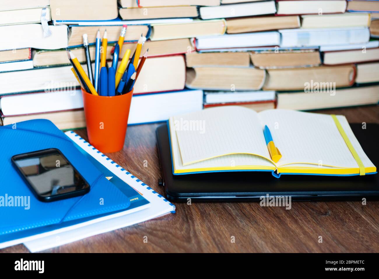 Textbook, notebook, laptop computer, mobile phone smartphone, stack of ...