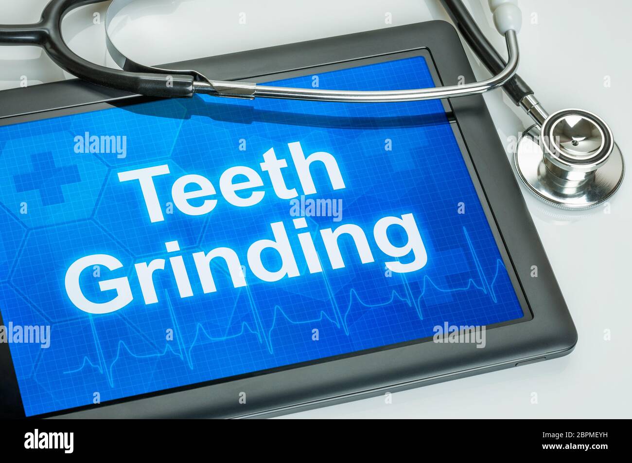 Tablet with the text Teeth grinding on the display Stock Photo