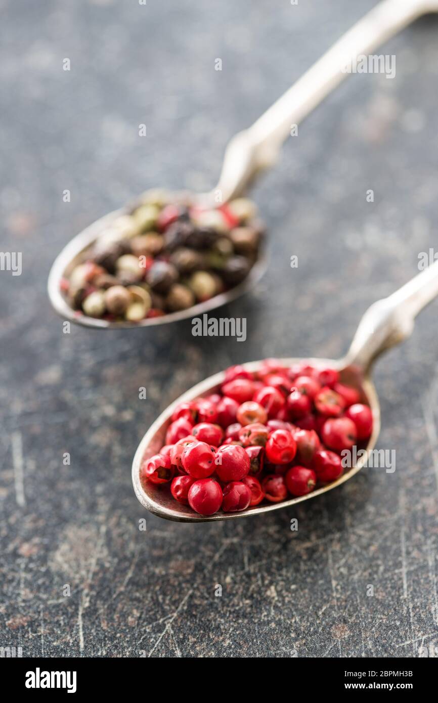 Dried pink peppercorn in spoon. Stock Photo