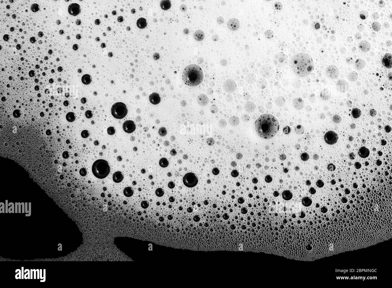 Detergent foam background. Soap foam with bubbles on black. Flat lay. Stock Photo