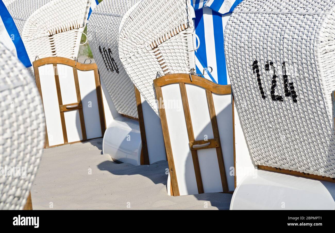white beach chairs on a sandy beach at the Baltic sea, Zingst, Germany Stock Photo