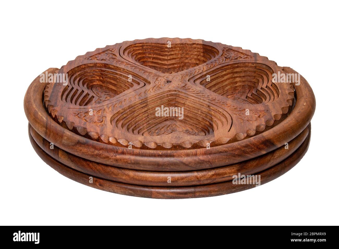 Wooden bowls. Closeup of handmade hinged wooden bowl for fruits, vegetables  and nuts isolated on a white background. Decorative souvenir from Malaysia  Stock Photo - Alamy