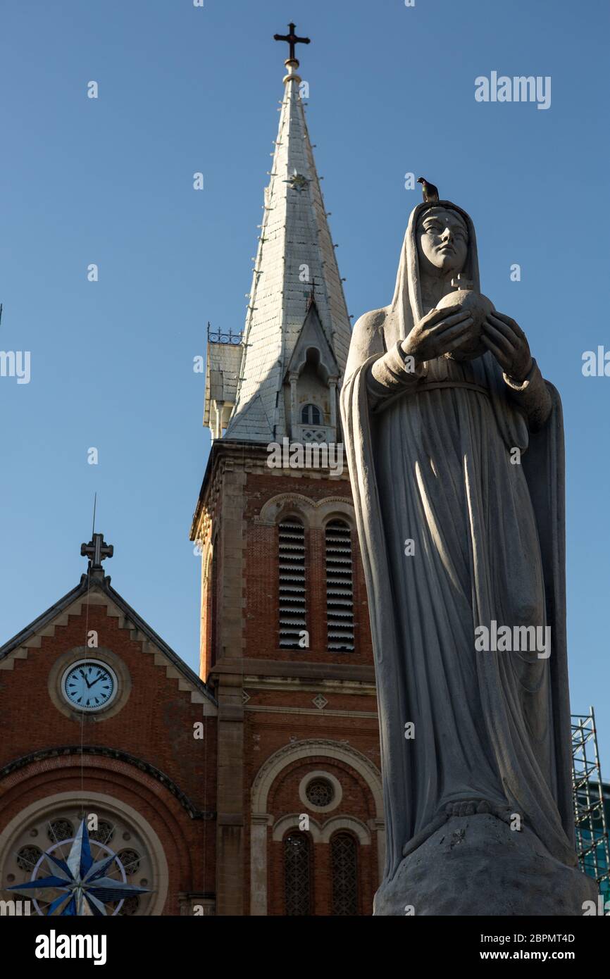 The Virgin Mary statue and exterior of Saigon Notre Dame Cathedral