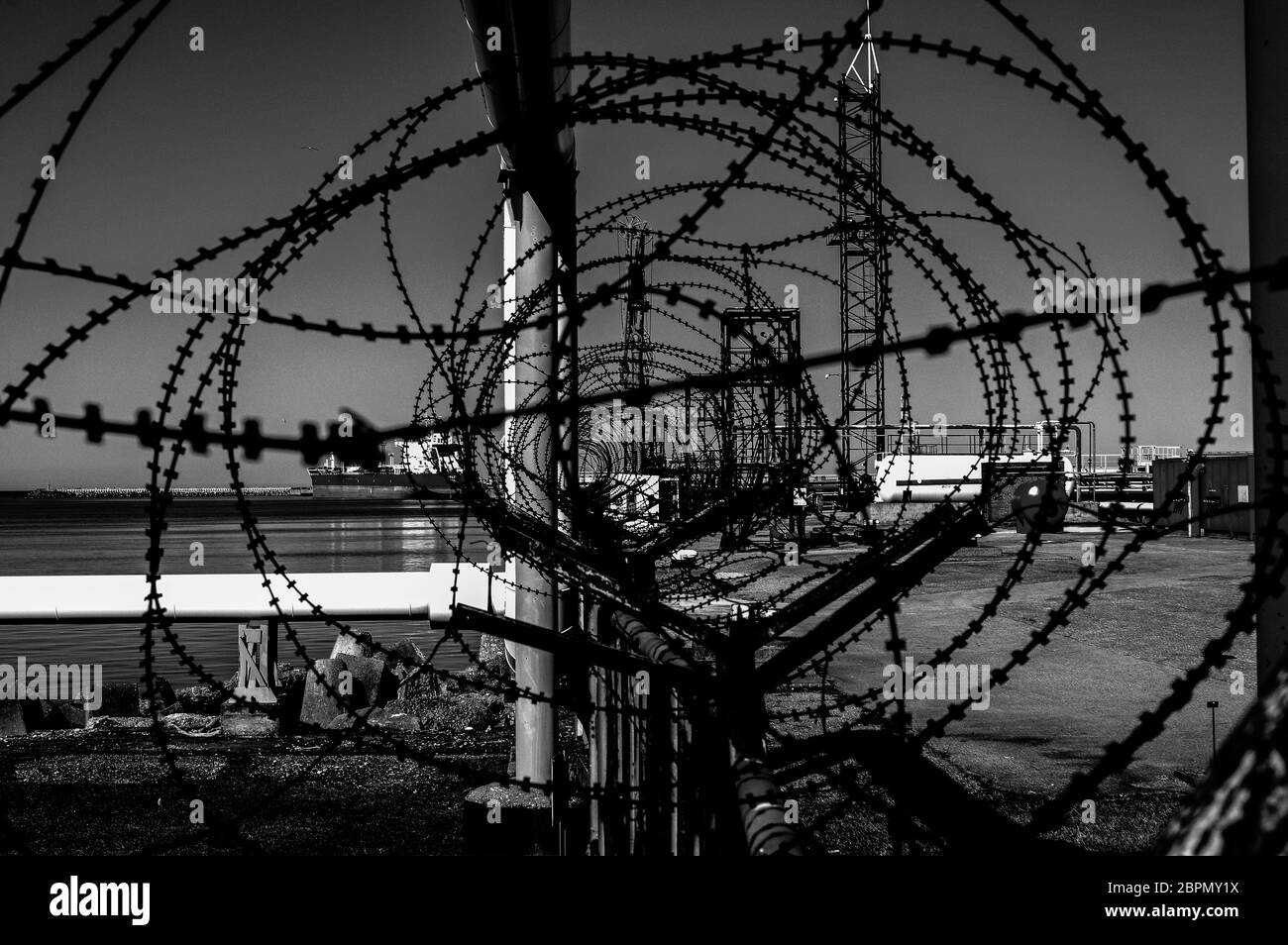 Barbed wire fences in industrial area Stock Photo Alamy
