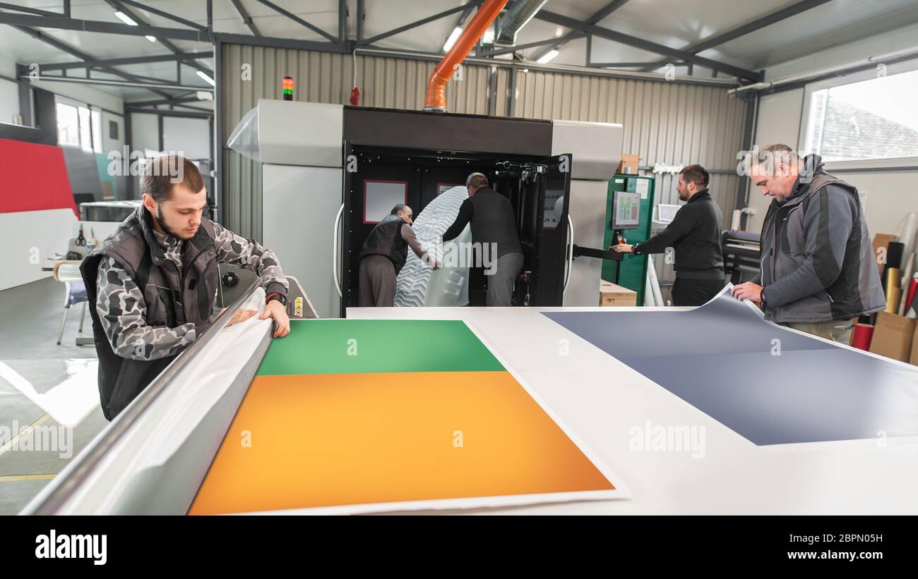 Large group of worker printmaker technician operator works in digital