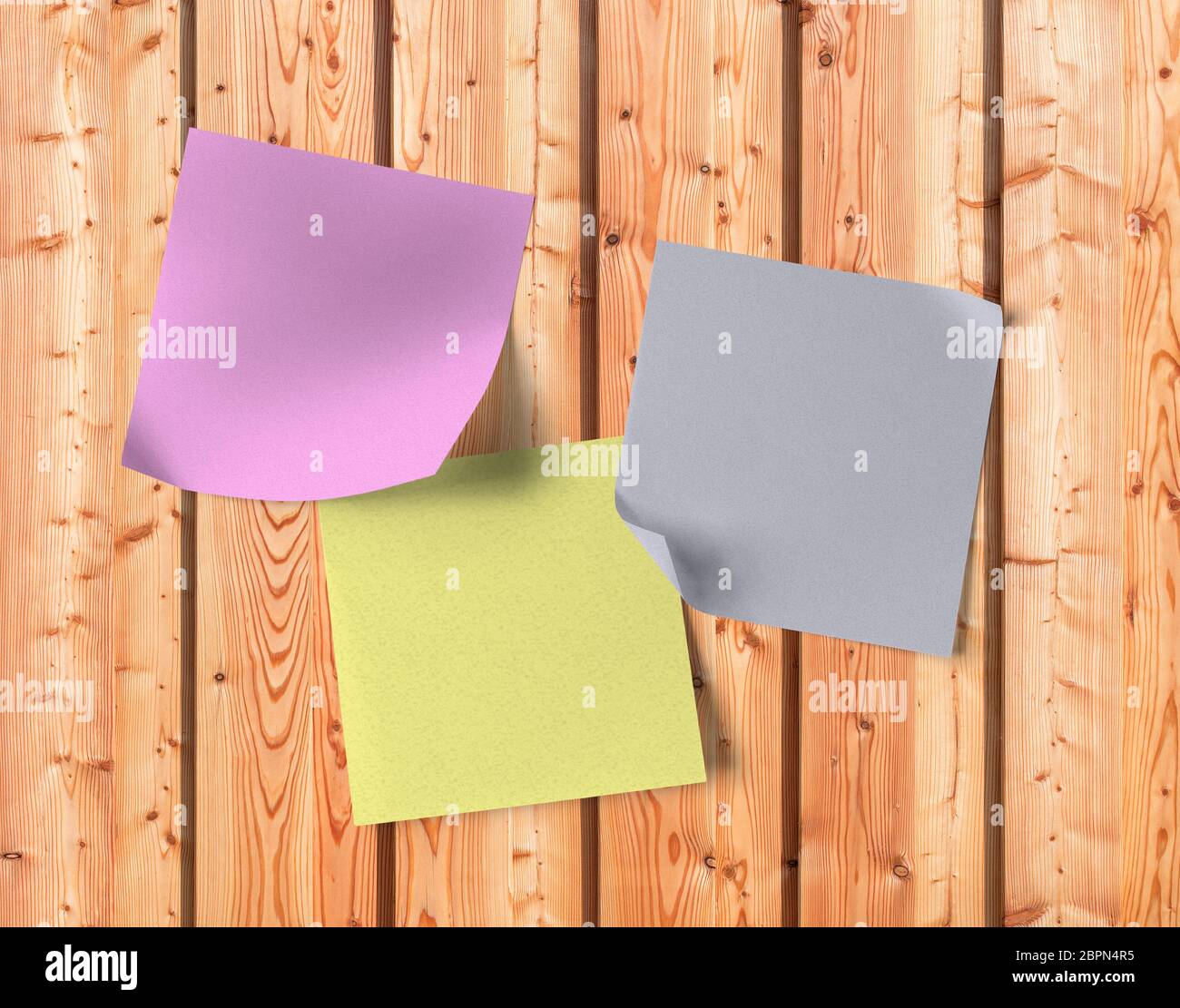 Blank sticky notes on wooden panels Stock Photo