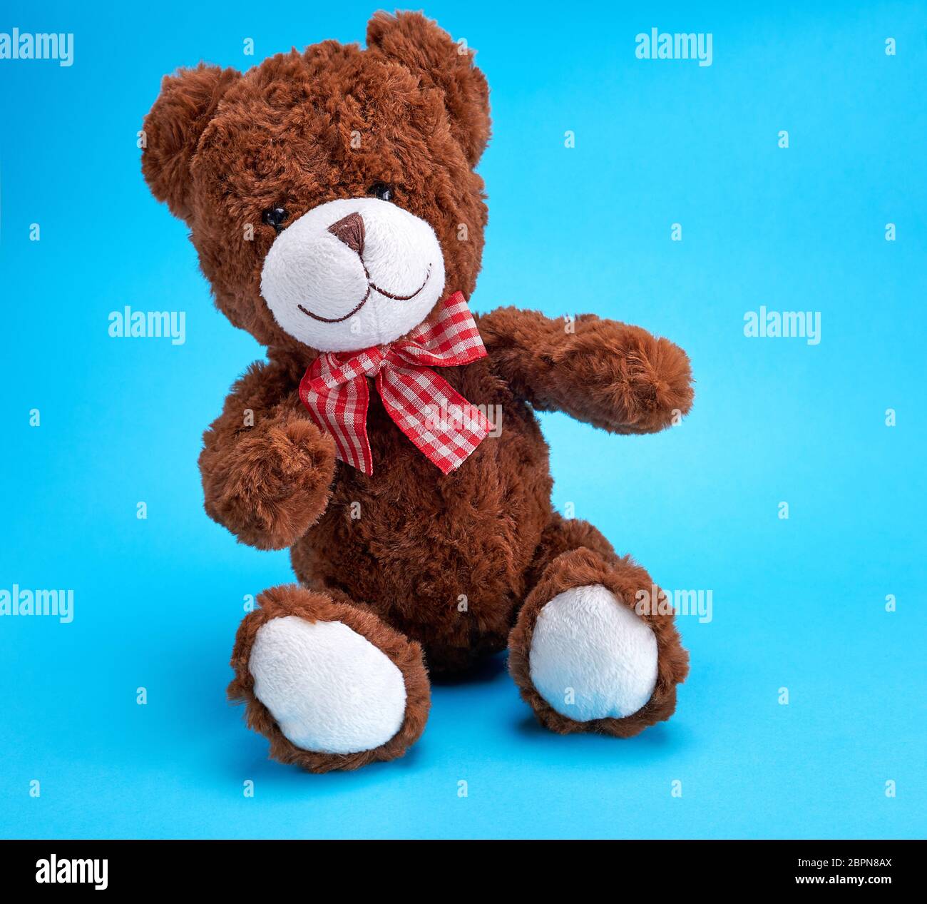 vintage brown teddy bear on blue background, copy space Stock Photo - Alamy