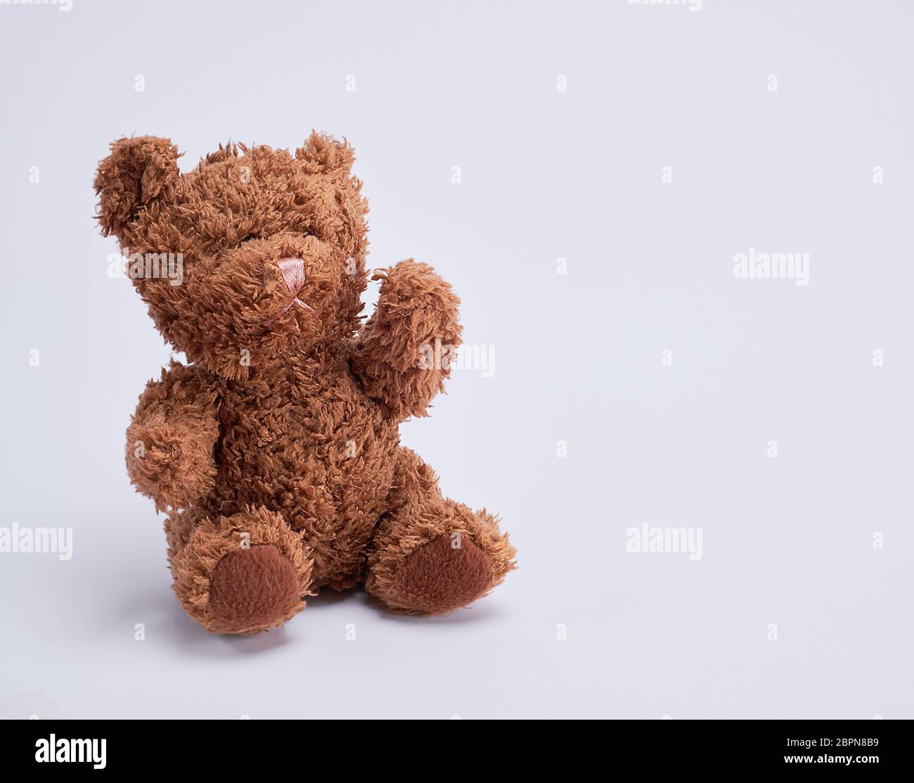 small brown teddy bear on a white background, copy space Stock Photo ...