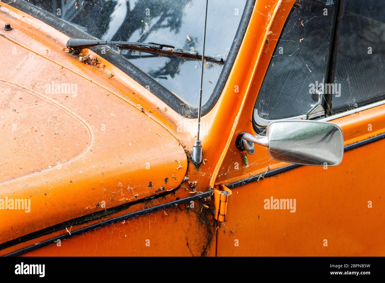 Close-up of an old orange Volkswagon Beetle car, rusty, unwashed and neglected, London, UK Stock Photo