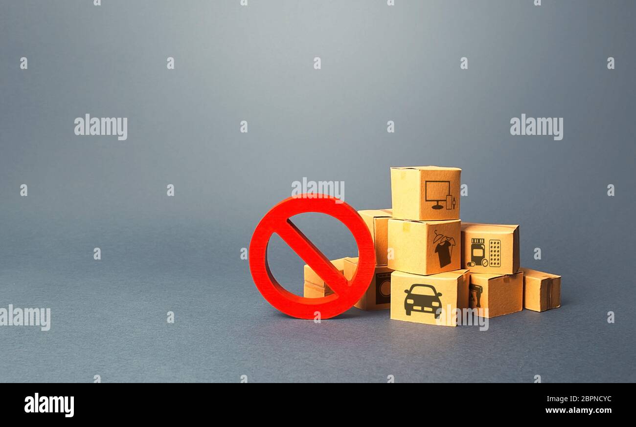 Boxes and red prohibition sign NO. Overproduction of goods, lack of demand. Sanctions and embargo. Shortage of products delivery. Transition of a trad Stock Photo