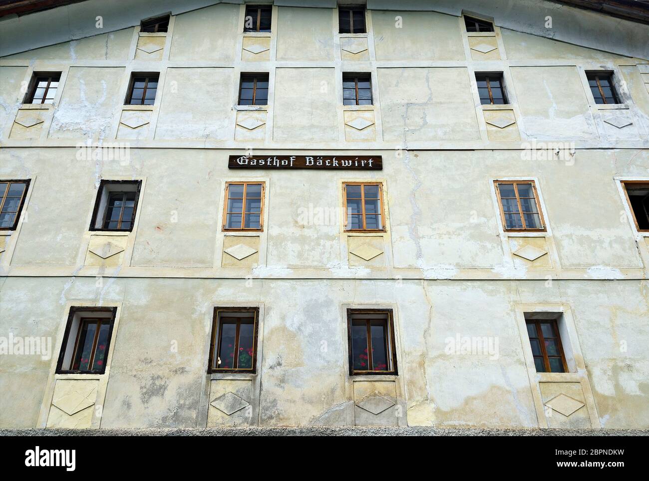 Facade of the old inn 'Gasthof Baeckwirt' in the pilgrimage destination Maria Luggau, Carinthia, Austria Stock Photo