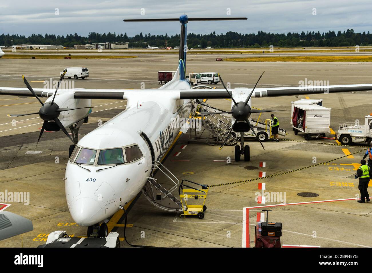 SEATTLE TACOMA AIRPORT, WA, USA - JUNE 2018: Alaska Airlines De Havilland DHC8 400 turboprop plane awaiting passengers to board at Seattle airport Stock Photo