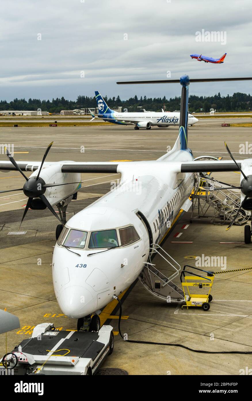 SEATTLE TACOMA AIRPORT, WA, USA - JUNE 2018: Horizon Air De Havilland DHC8 400 turboprop plane operated for Alaska Airlines Stock Photo