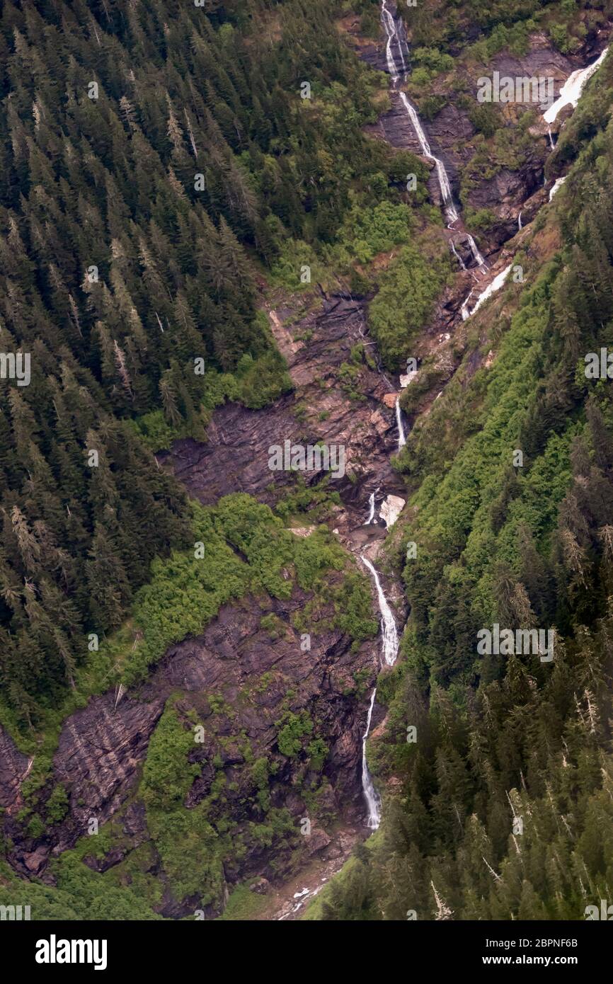 Long series of waterfalls in late spring, Kitimat Range of the Coast Mountains, British Columbia. Stock Photo