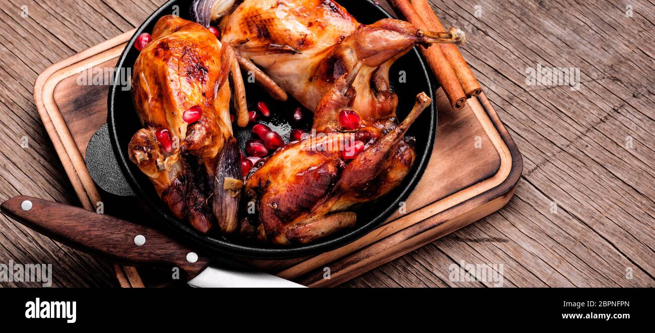 Quail fried in iron cast pan.Roasted quail Stock Photo Alamy