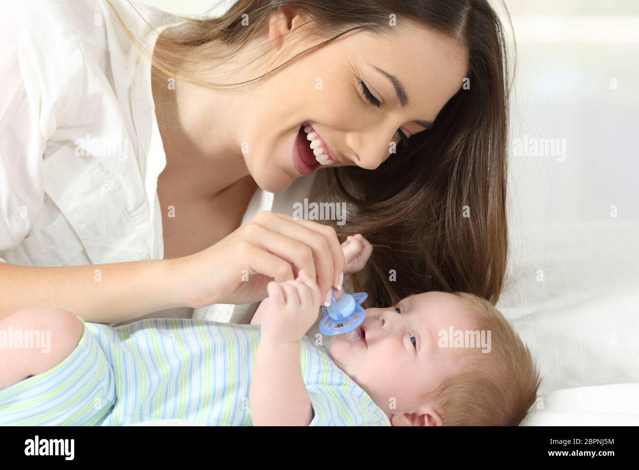 giving baby pacifier