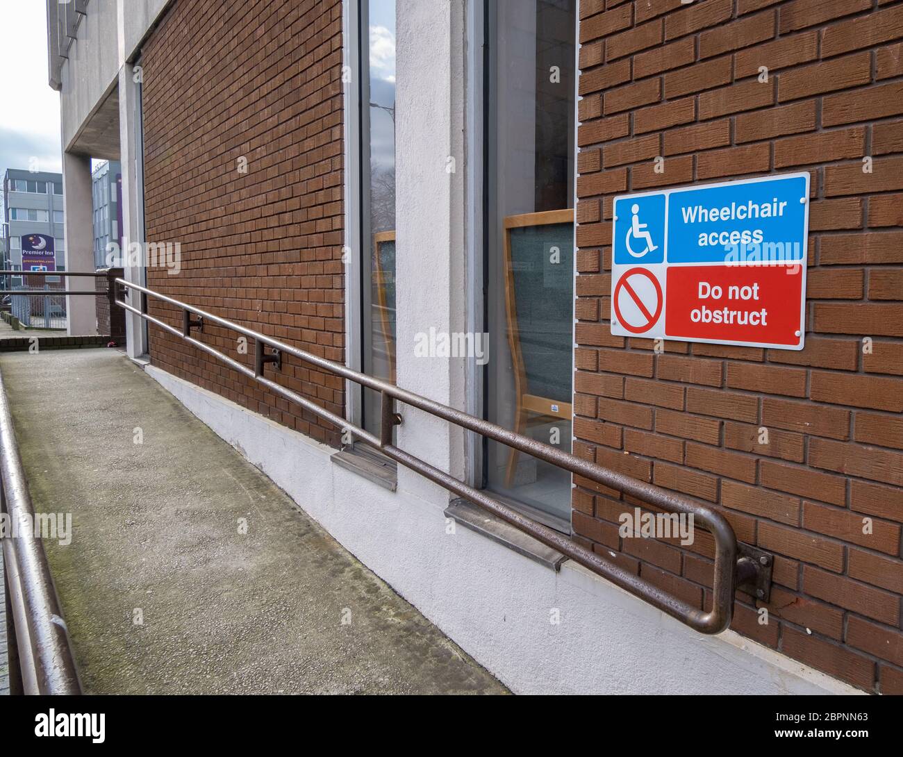 Building Ramp Signages Concrete wheelchair ramp with signs outside building inBirkenhead ...
