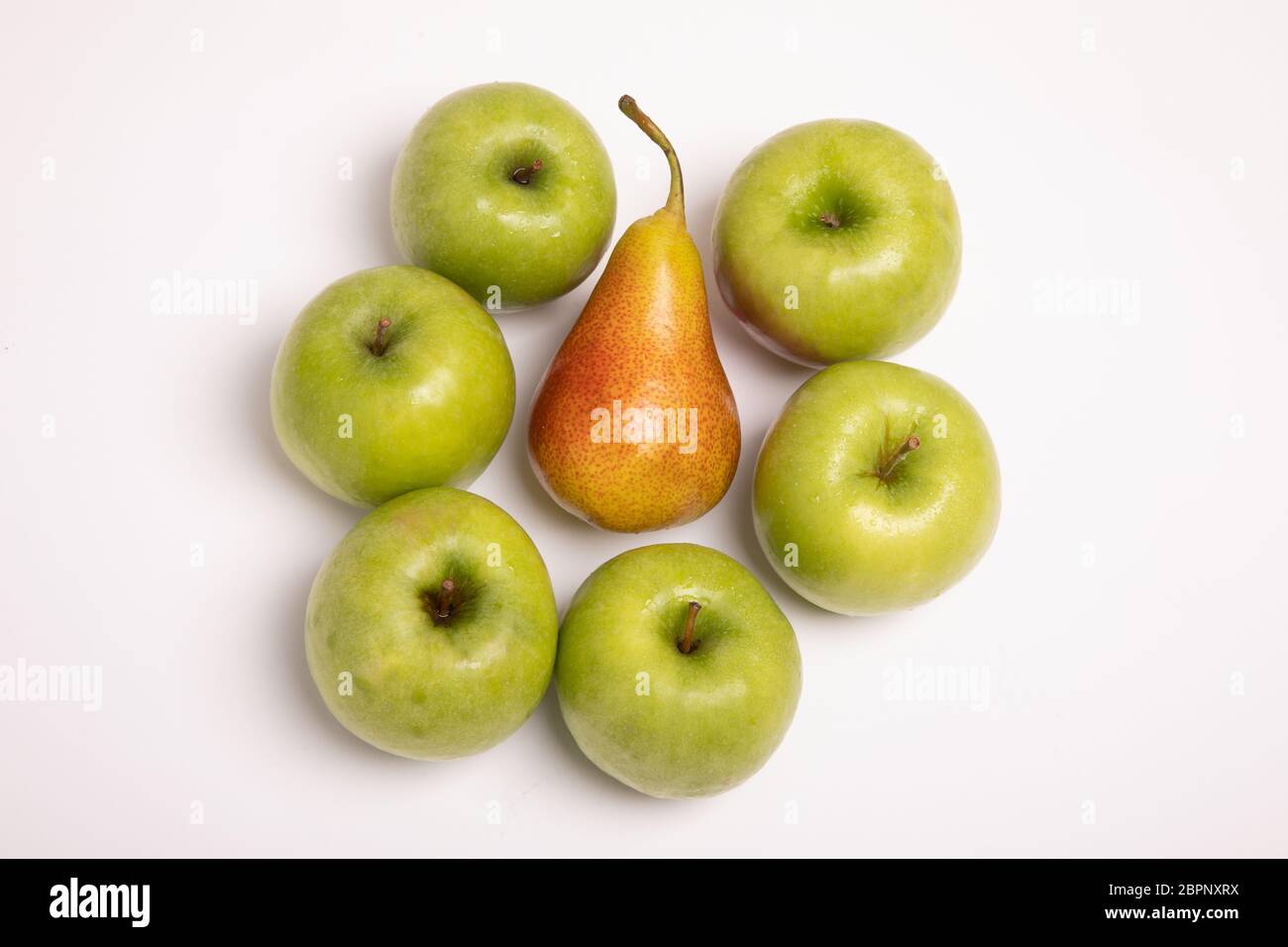 Compare apples with pears. Fresh fruit isolated on white background ...