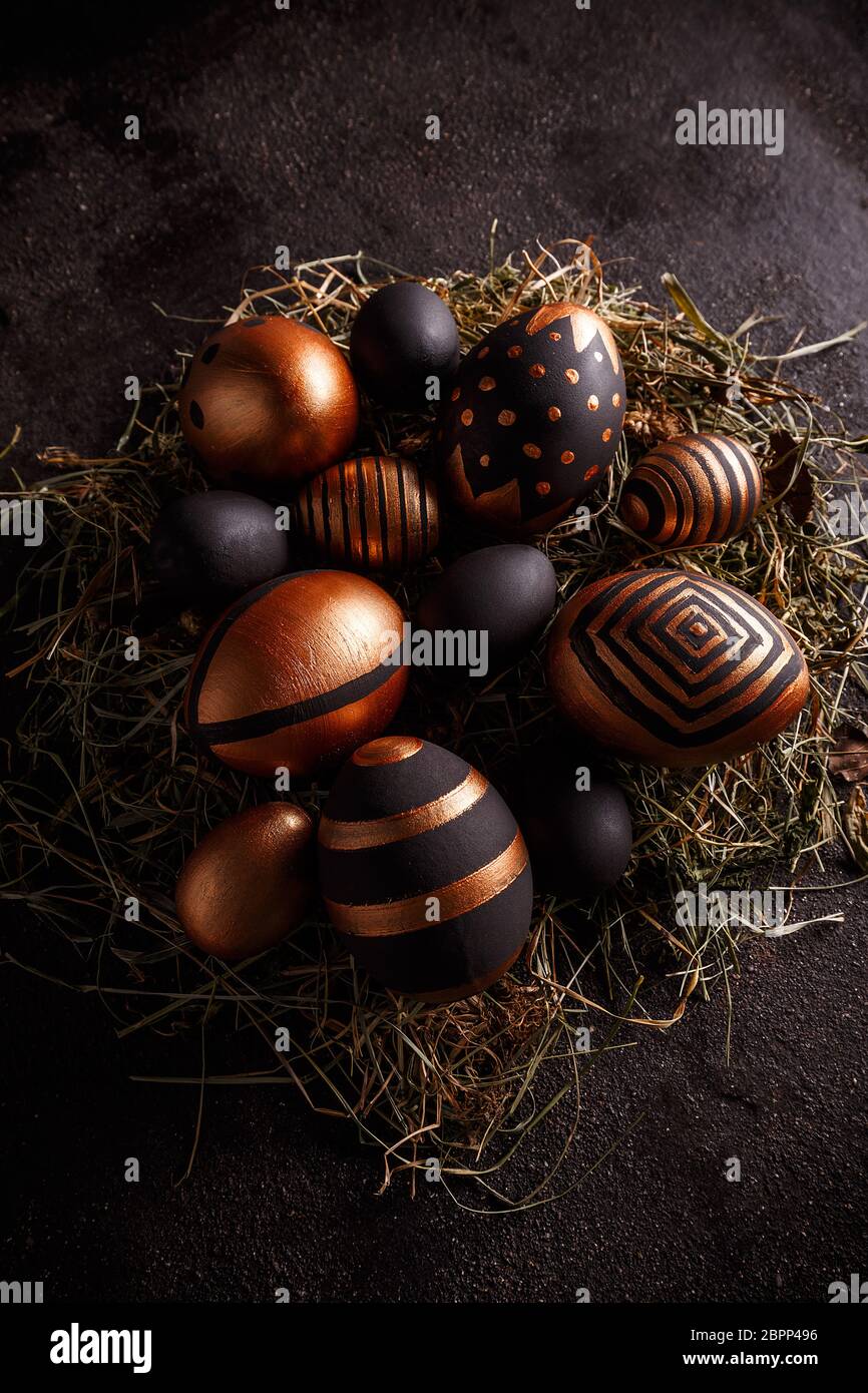 Easter composition with black and gold decorative Easter eggs Stock Photo